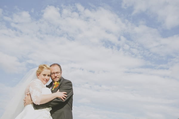 Bride and groom with blue sky