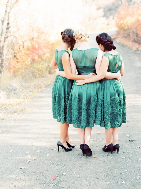 Bridesmaids with arms around each other