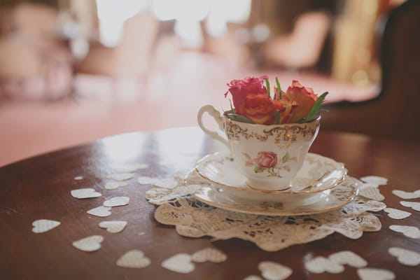 Teacup with hearts around it