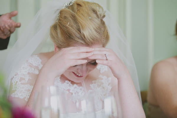 Bride with head in hands