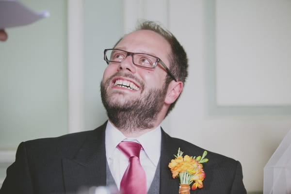 Groom looking up at best man