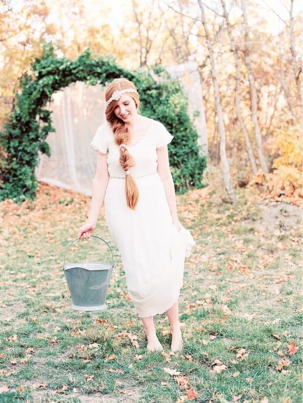 Bride carrying bucket