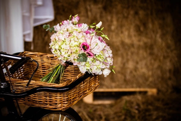 Wedding bouquet in basket of vintage bicycle