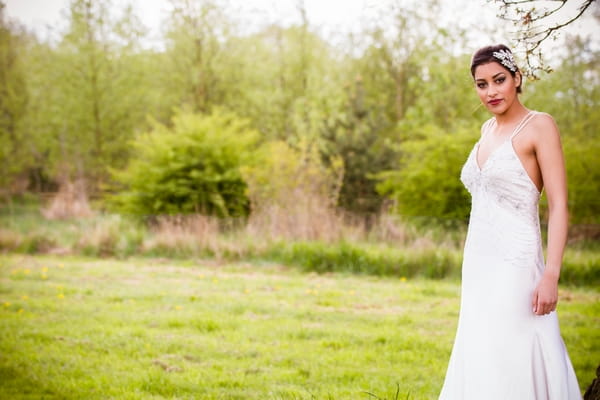 Bride standing on grass