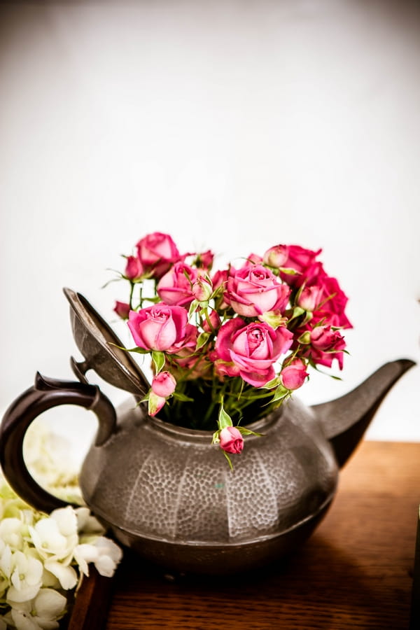 Teapot with flowers in it