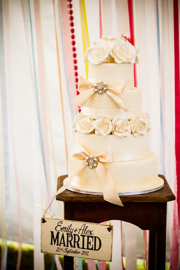 Rose and bow cream wedding cake