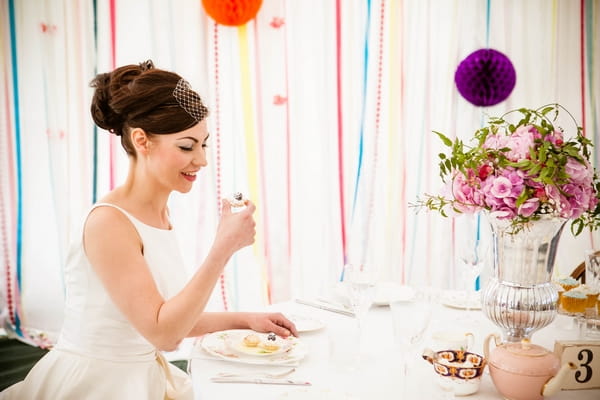 Bride about to eat cupcake