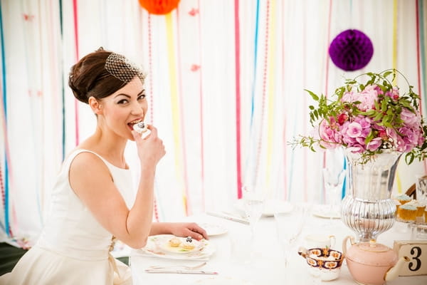 Bride eating cupcake