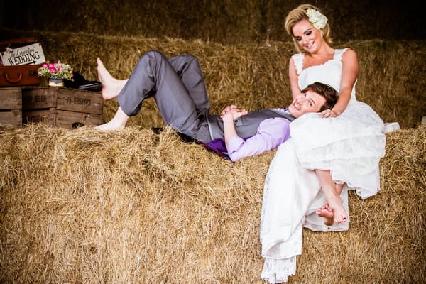 Groom laying in bride's lap