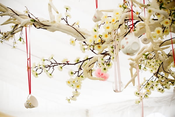 Wedding items hanging from tree branches