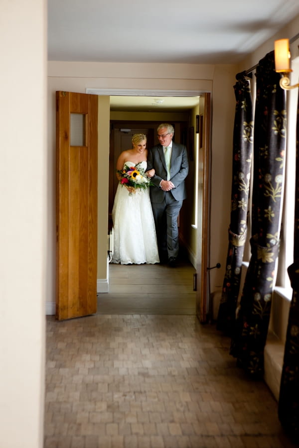 Bride walking with father