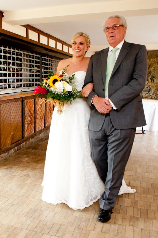 Father eading bride to altar