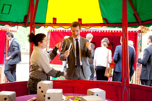 Wedding guest playing funfair game