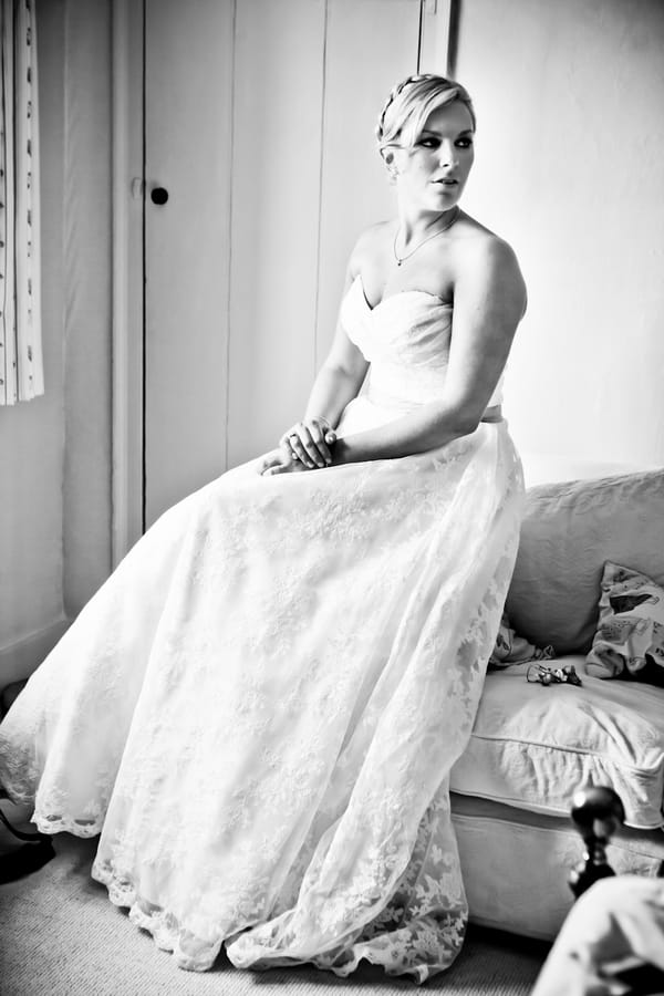 Bride sitting on bed