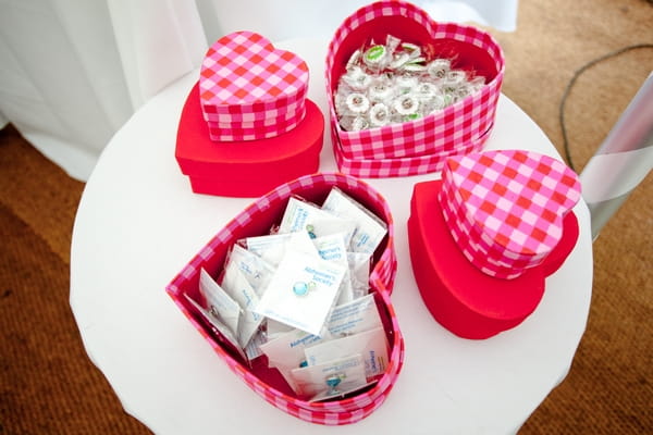 Heart boxes with wedding favour pin badges