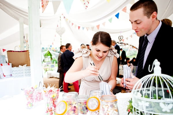 Guests at wedding sweetie table