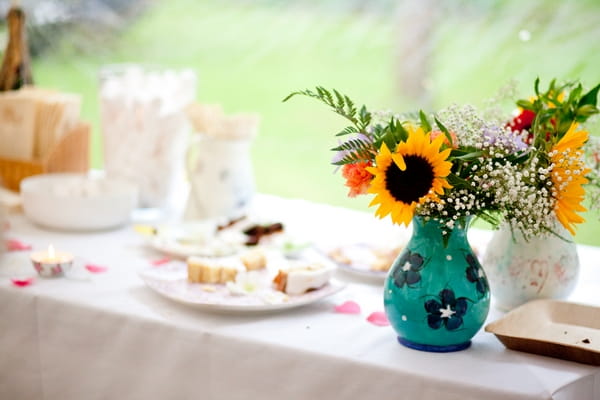 Green vase of flowers