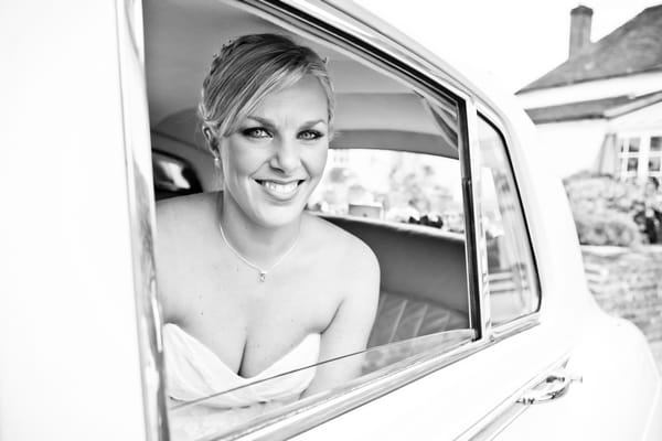 Bride in wedding car