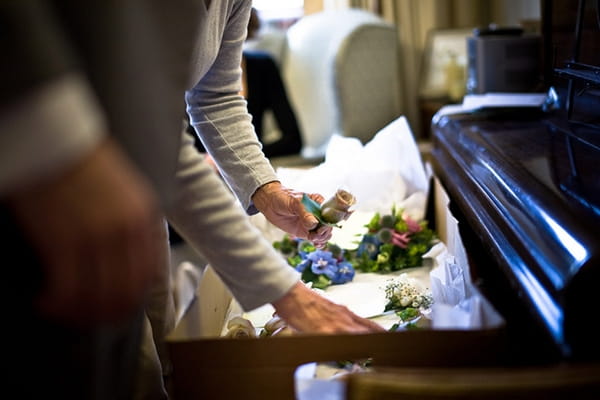 Wedding flowers being put in a box