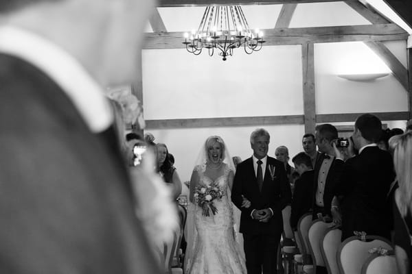 Bride and father walking down the aisle