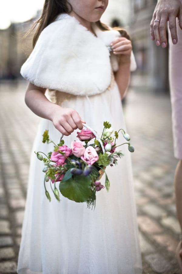 Flower girl carrying flower basket