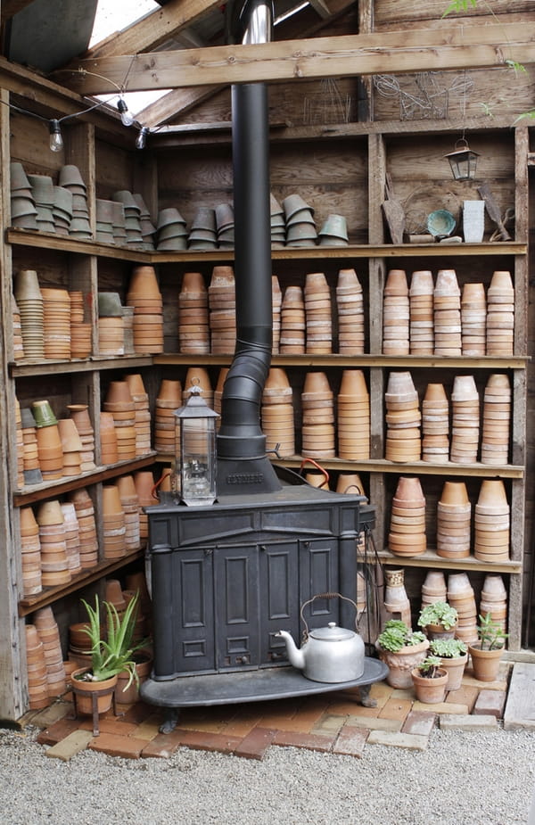 Old stove with shelves of pots