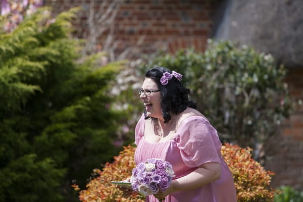 Bridesmaid laughing