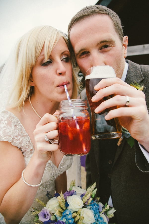 Bride and groom drinking