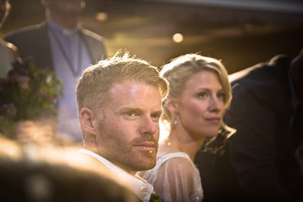 Bride and groom listening to reading