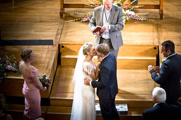 Bride and groom kiss