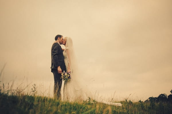 Bride and groom kiss