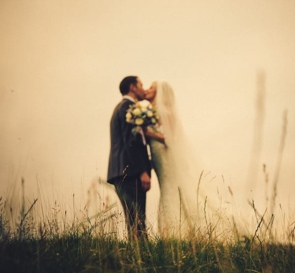 Bride and groom kiss