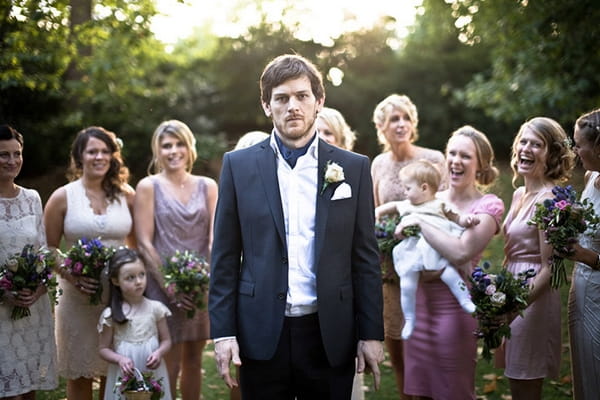 Man standing with bridesmaids