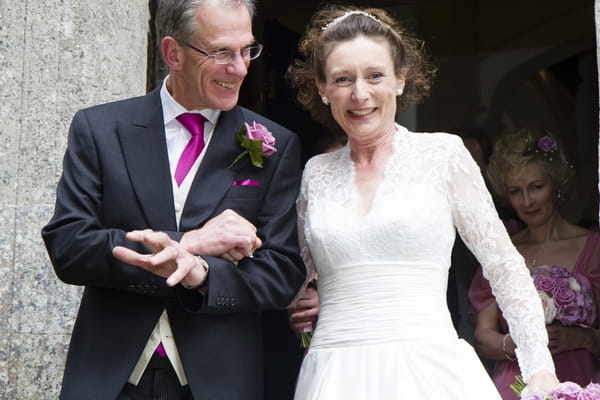 Bride and groom leave church