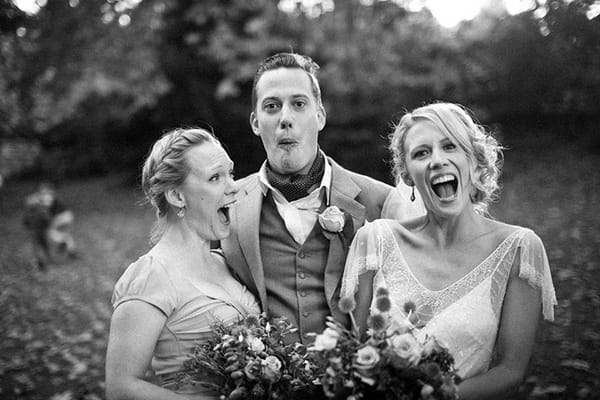 Bride and wedding guests pulling faces