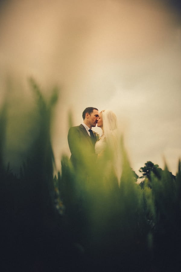 Bride and groom kiss