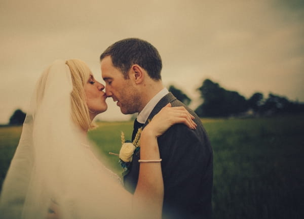 Bride kissing groom on the nose