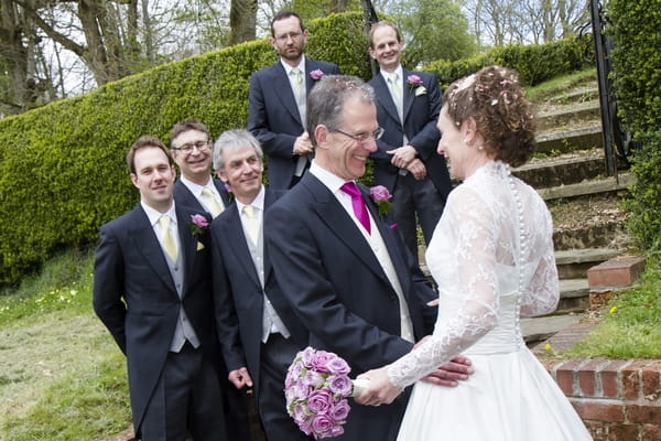 Bride and groom with groomsmen