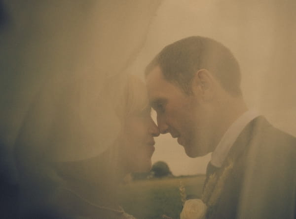 Bride and groom touching noses