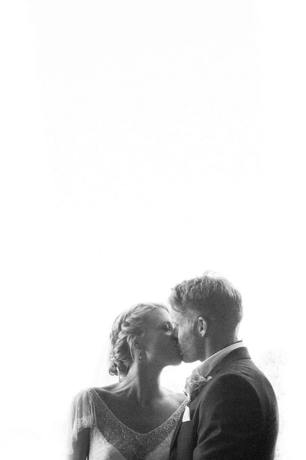 Bride and groom kissing