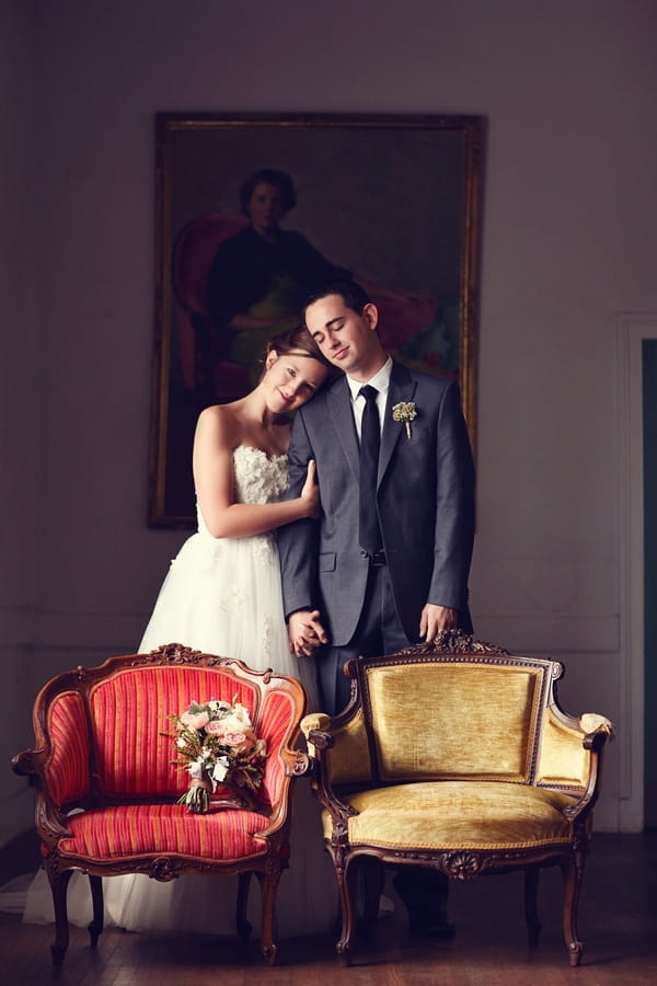 Bride with head on groom's shoulder