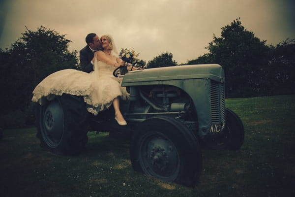 Bride and groom on tractor