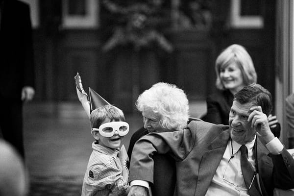 Boy at wedding wearing mask