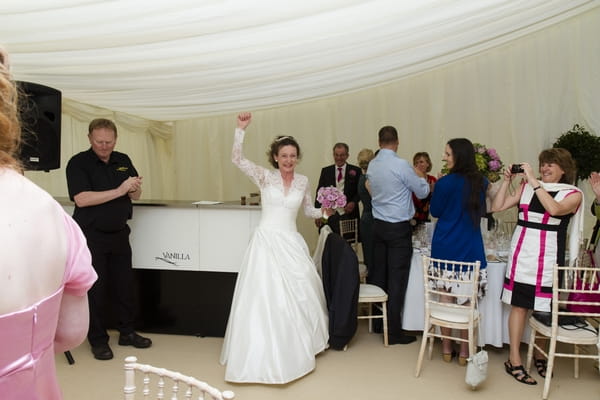 Bride entering wedding breakfast