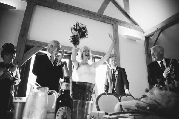 Bride and groom enter wedding breakfast