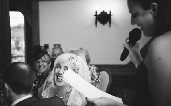 Bride laughing at speech