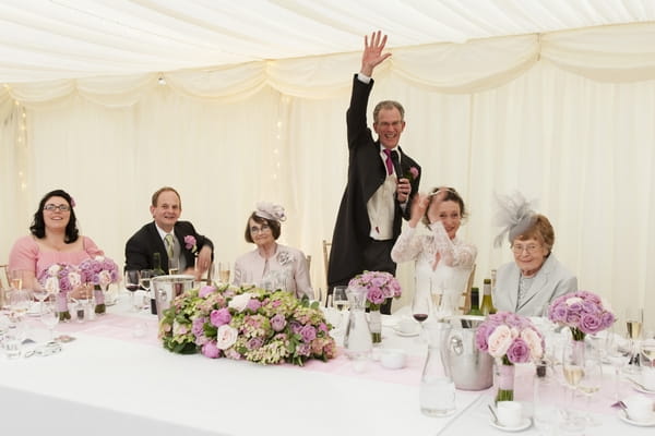 Groom waving