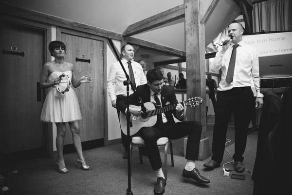 Guitar player at wedding for speech