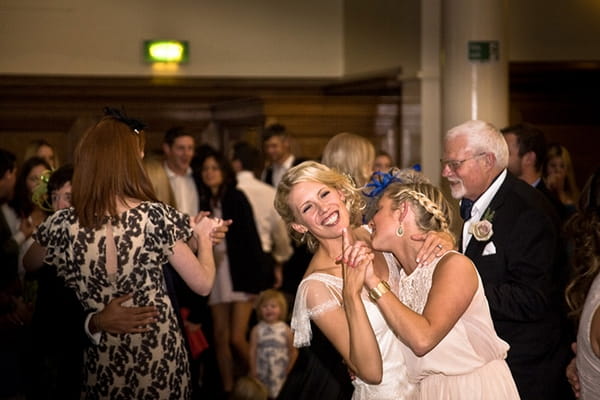 Bride and bridesmaid dancing