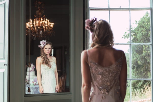 Bride looking in mirror